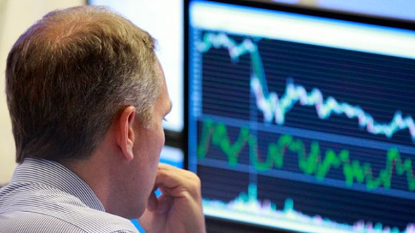 currency trader at his desk