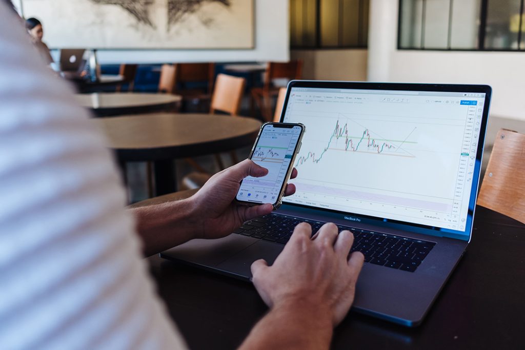 a forex trader monitoring the markets on a computer